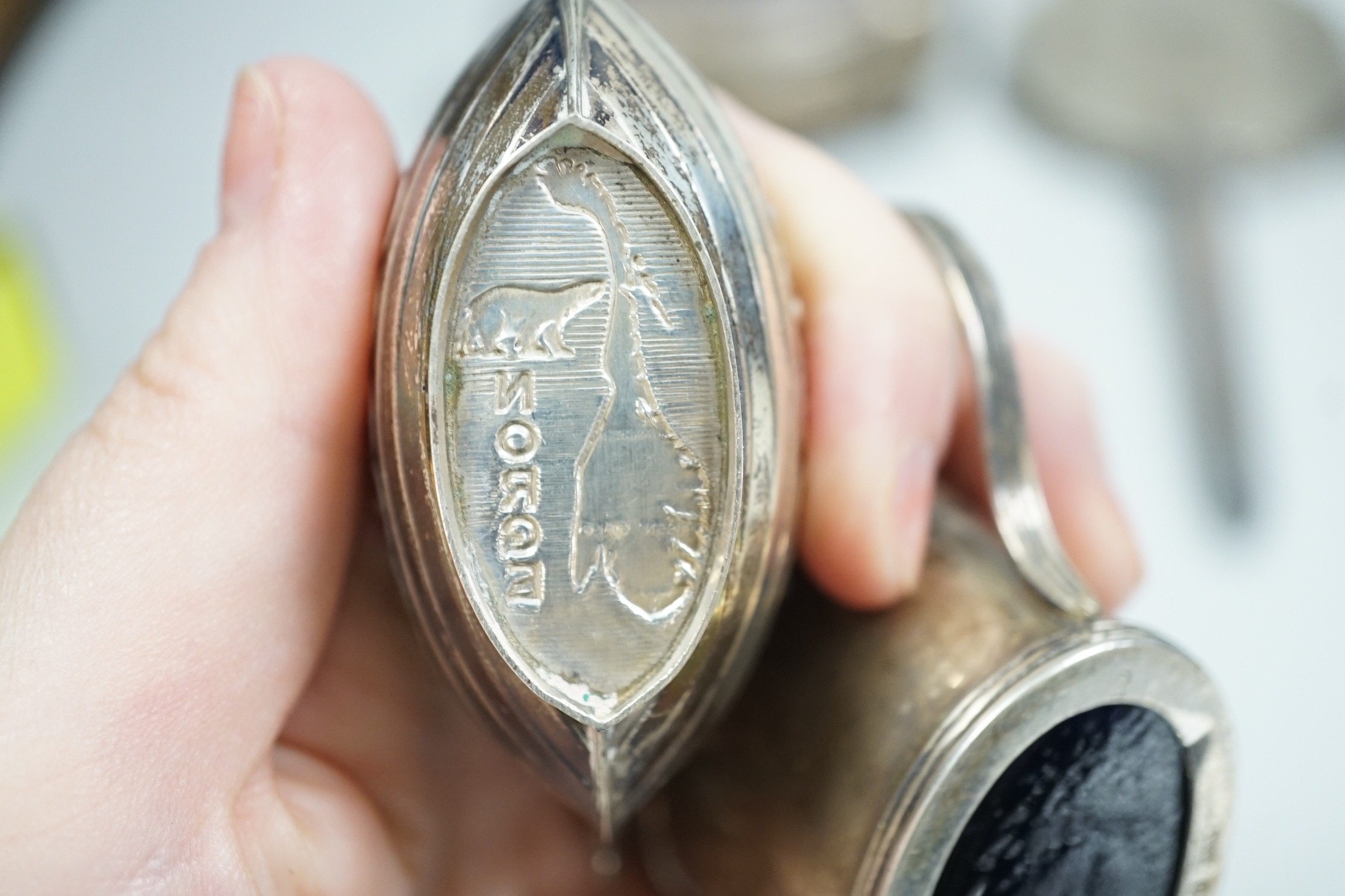 A George V silver mounted trinket box, Elkington & Co, Birmingham, 1918, 13.1cm, a silver mustard pot, two Scandinavian 925 condiments, two silver mounted scent bottles, hatpins and hatpin stand and a silver mounted thre